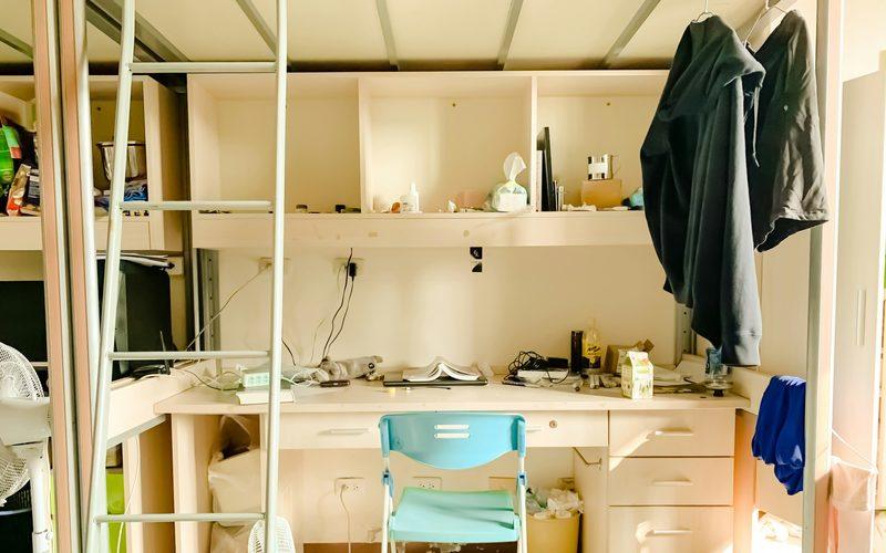 Student room with a desk and loft bed