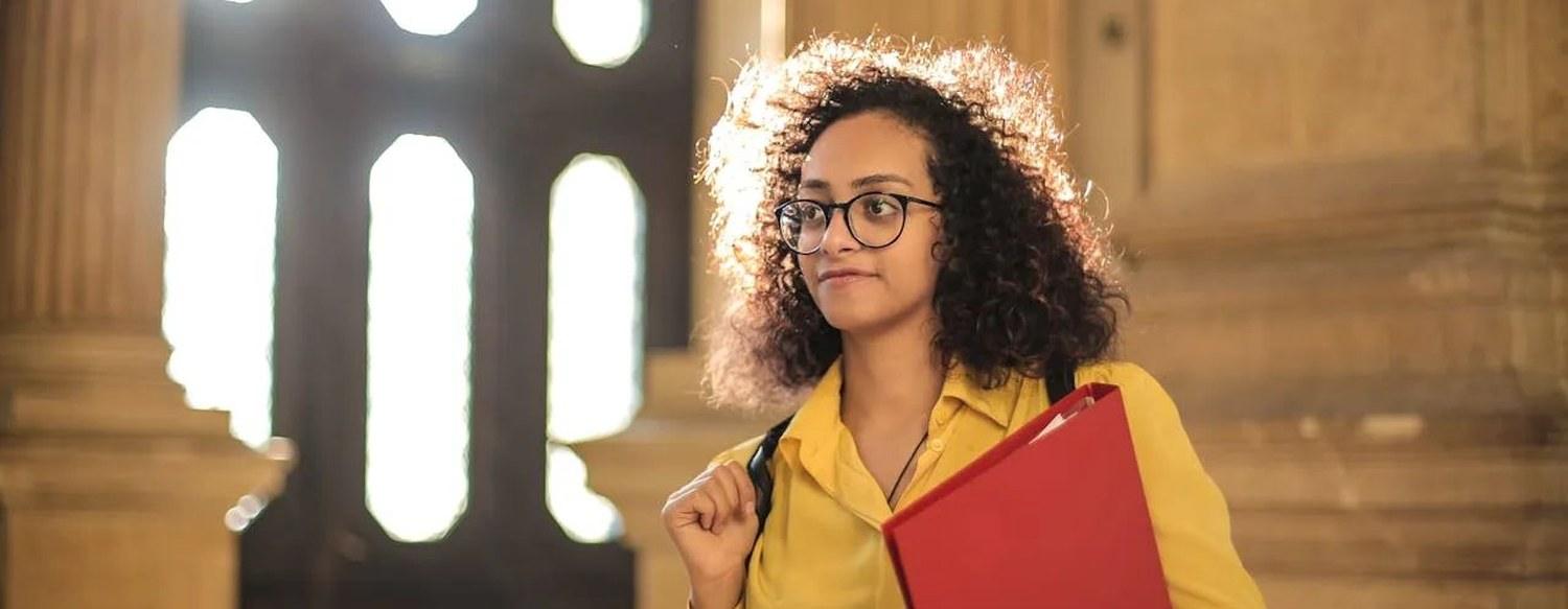 International student holding her application folder